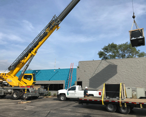 Crane Installing HVAC Products