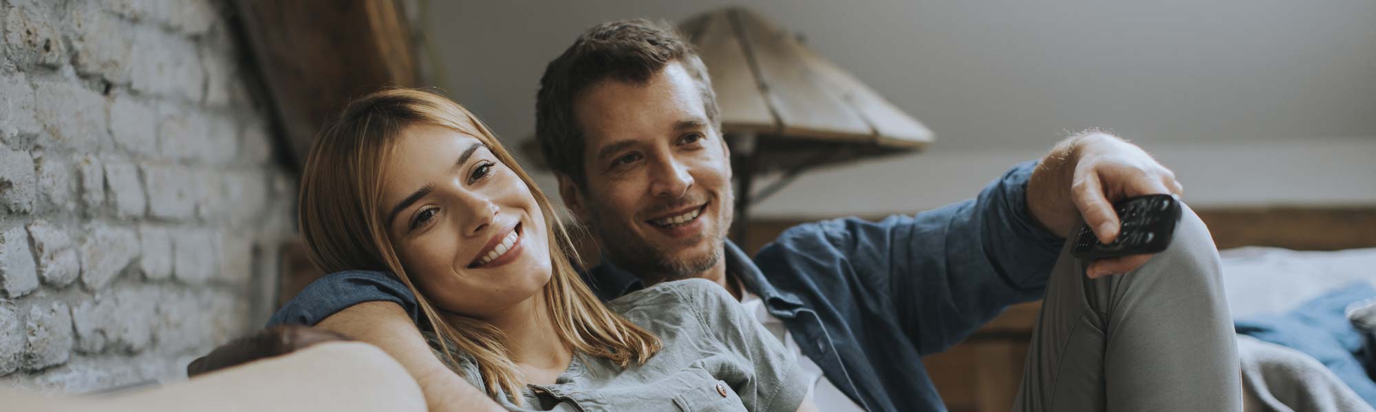 Couple enjoying furnace on couch
