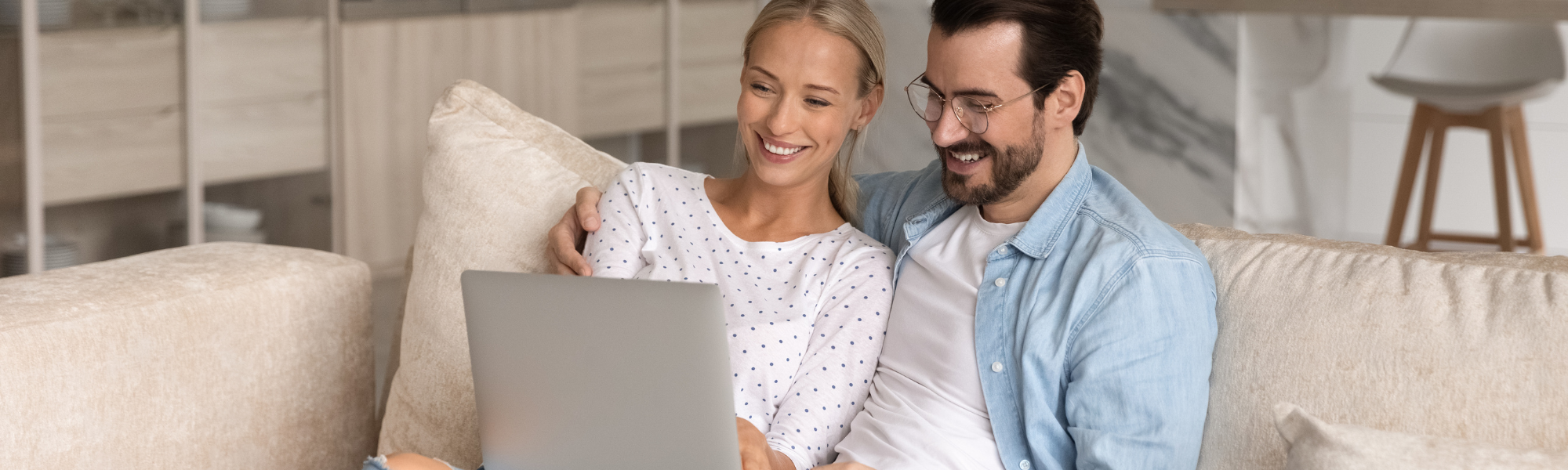 Woman And Man Looking At Laptop